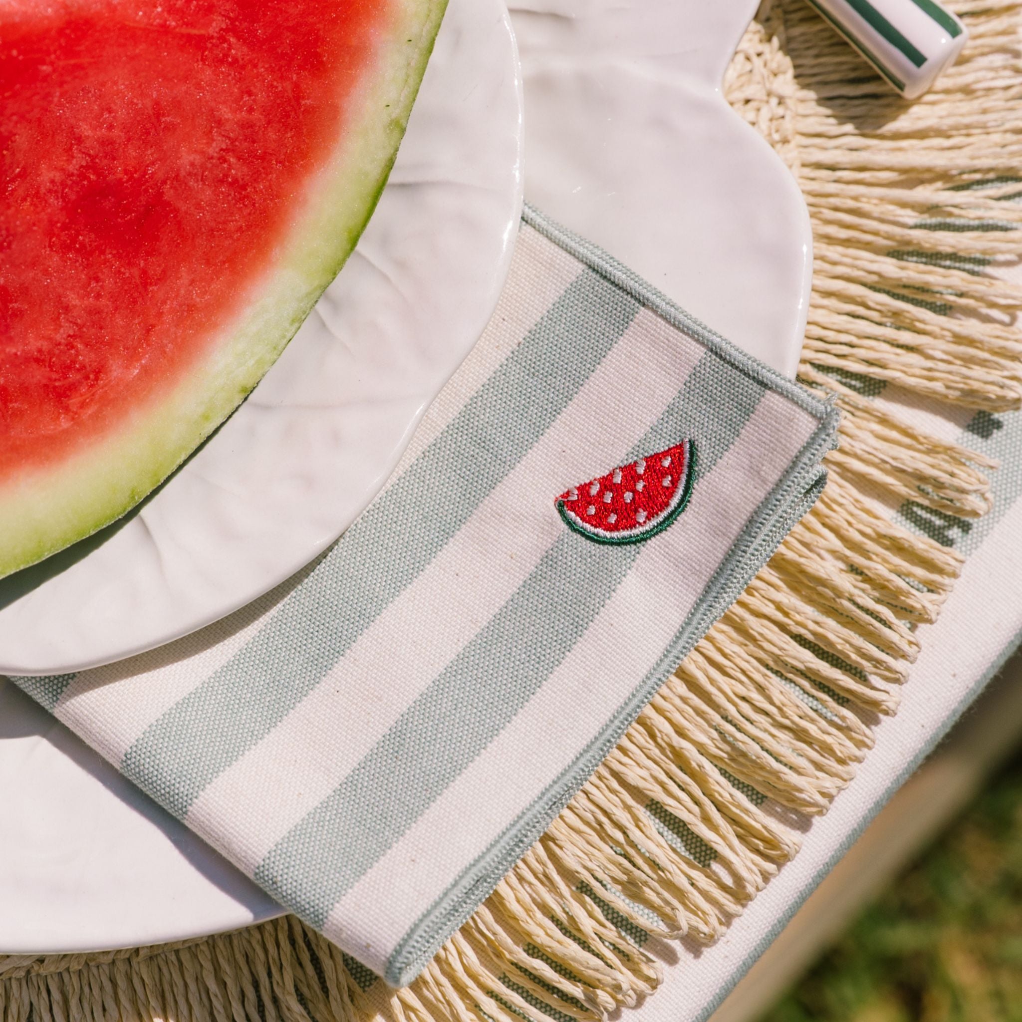 Striped napkin with watermelon design on a plate of watermelon