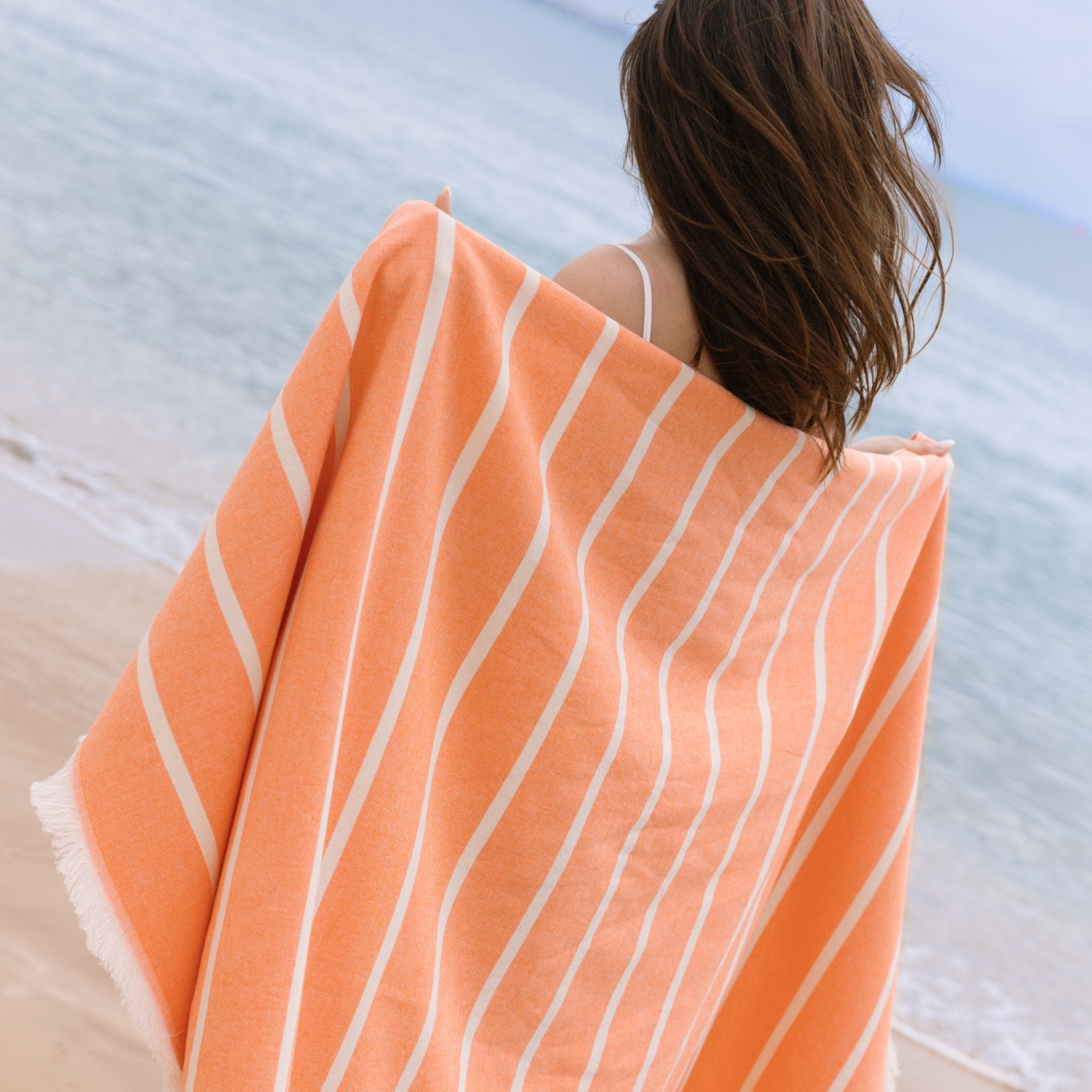 torres-novas-beach-belem-horizontal-stripes-towel-orange-lifestyle-3.jpg