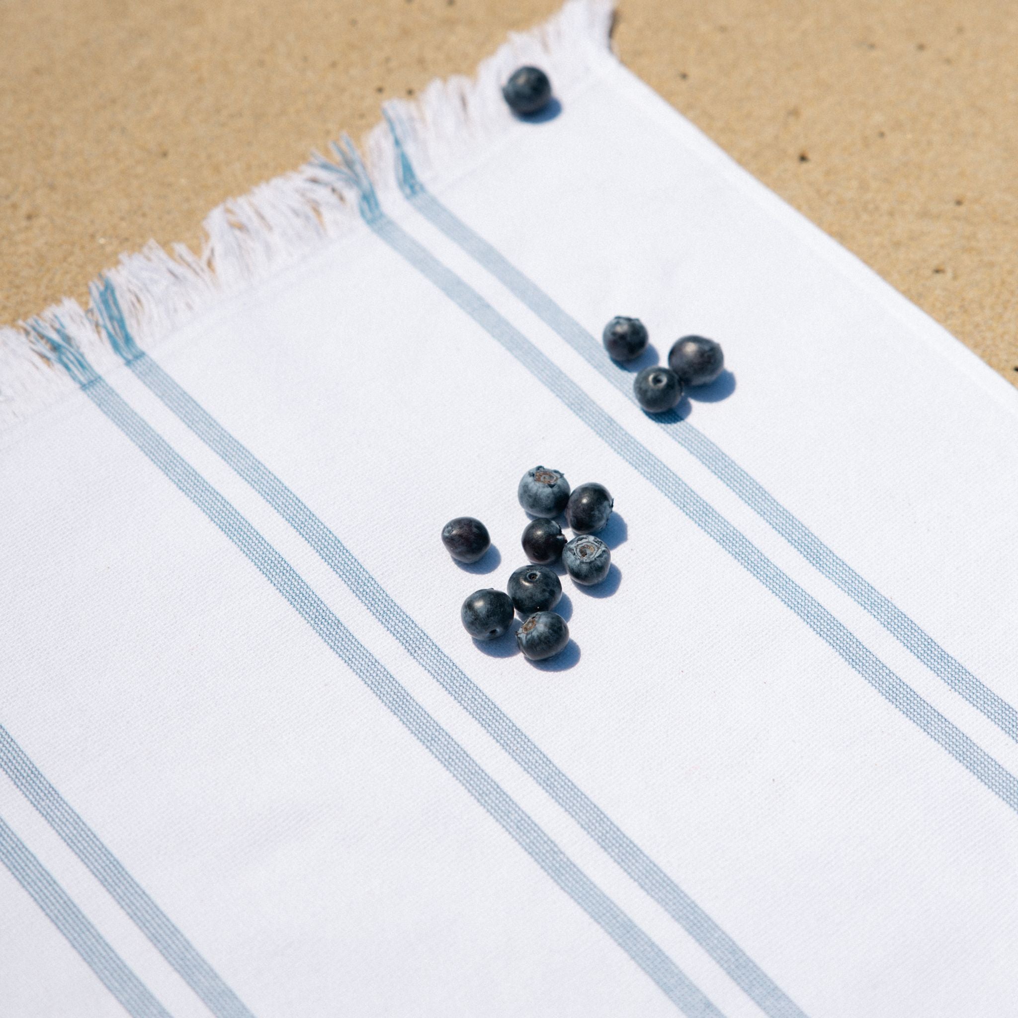 torres-novas-beach-caparica-vertical-stripes-towel-blue-lifestyle-3.jpg