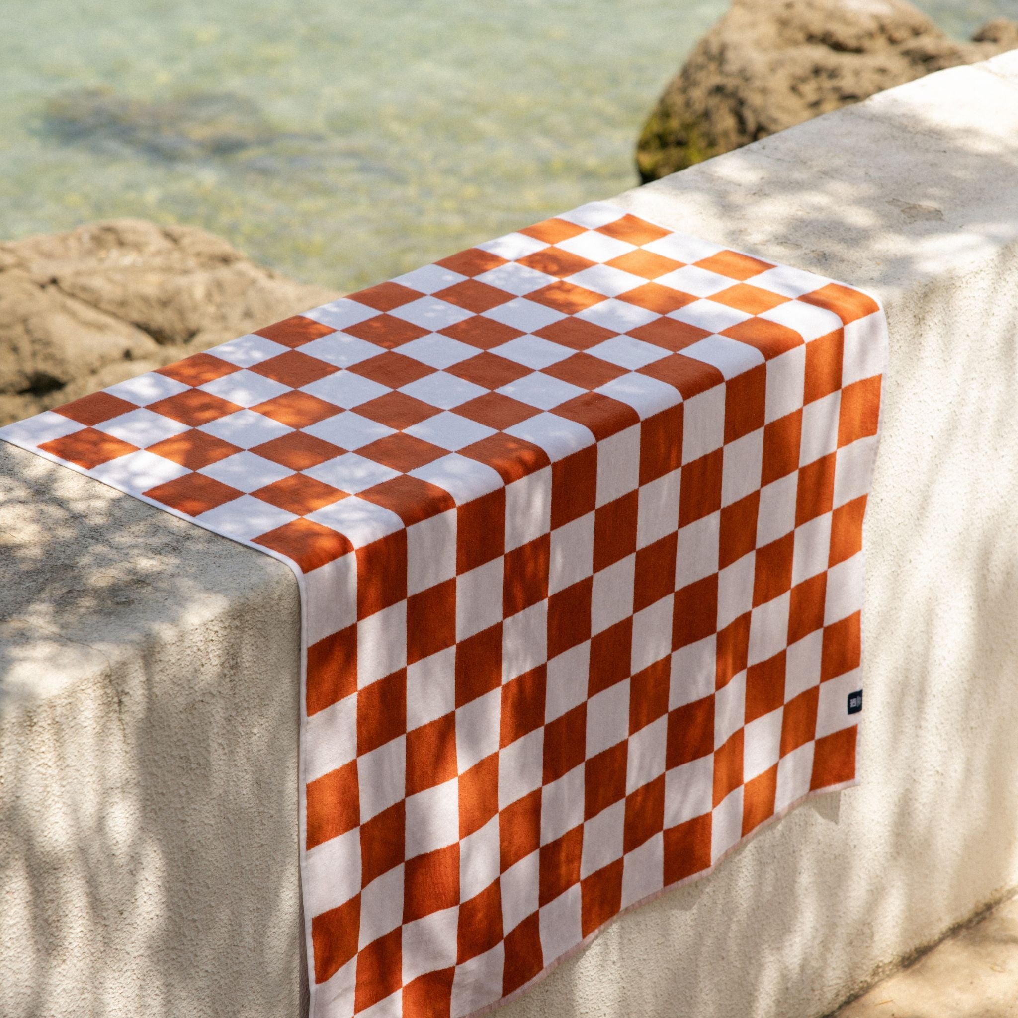 torres-novas-beach-chequered-gibalta-checkers-towel-terracotta-lifestyle-4.jpg