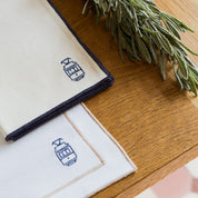 Nazaré white cotton table linen with embroidered Portugal-inspired motifs - Torres Novas
