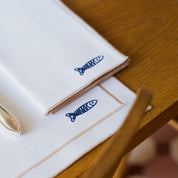 Nazaré white cotton table linen with embroidered Portugal-inspired motifs - Torres Novas