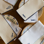 Nazaré white cotton table linen with embroidered Portugal-inspired motifs - Torres Novas